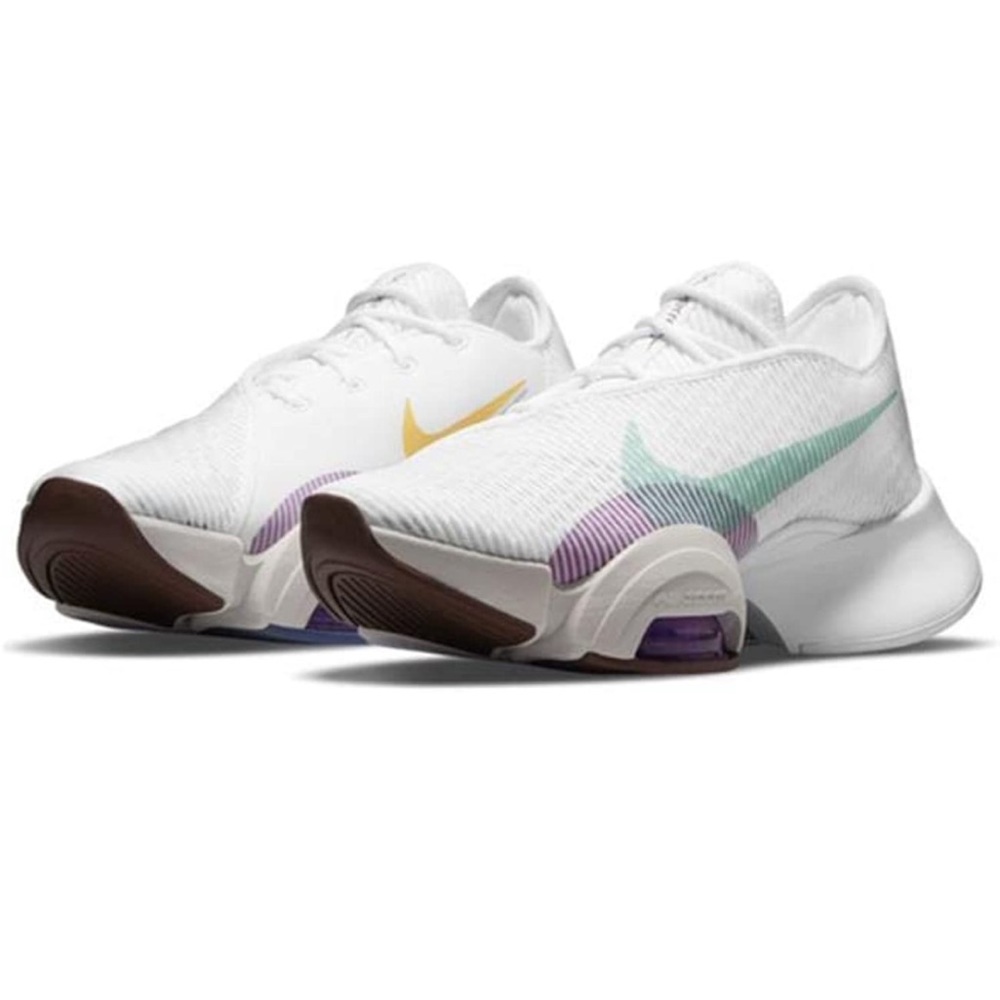 Nike White Sneakers with Gold and Purple Accents